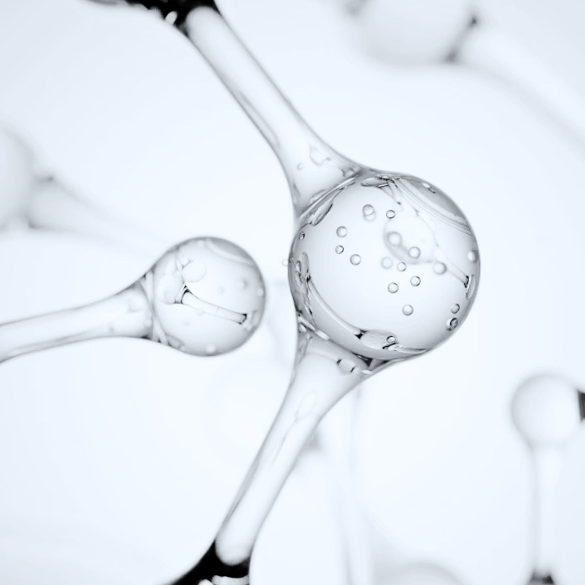 Abstract close-up of molecular-style structures with rounded nodes on a very light blue-gray background.